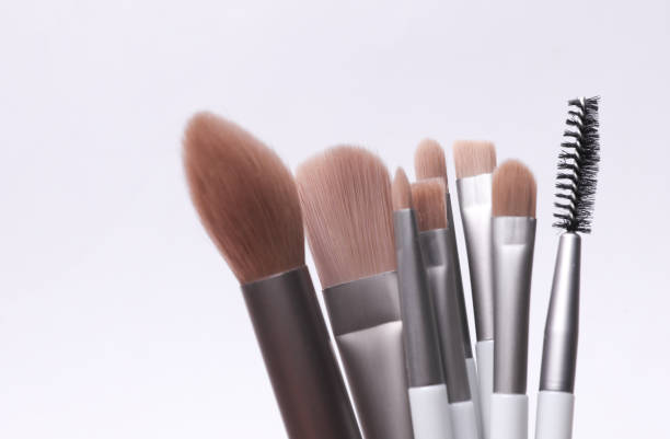 istock Set of makeup brushes on a gray background 2197630097