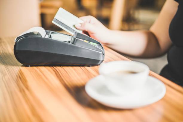 istock A customer paying with a credit card in a cafe 2197634867