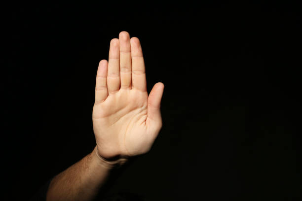 istock Male hand on a black background 2197637424