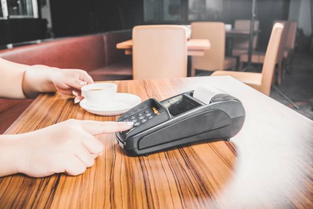 istock Paying the bill in a restaurant with a credit card 2197637761