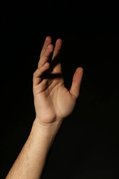 istock Male hand on a black background 2197637868