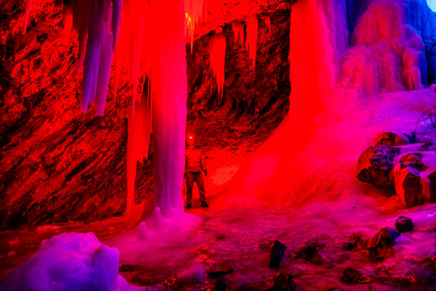 Iconic photo from inside the Kungur Ice Cave in Russia, showing illuminated ice formations, stalactites, and unique textures of the underground world. A famous natural landmark and popular tourist attraction representing geology, nature, and exploration.