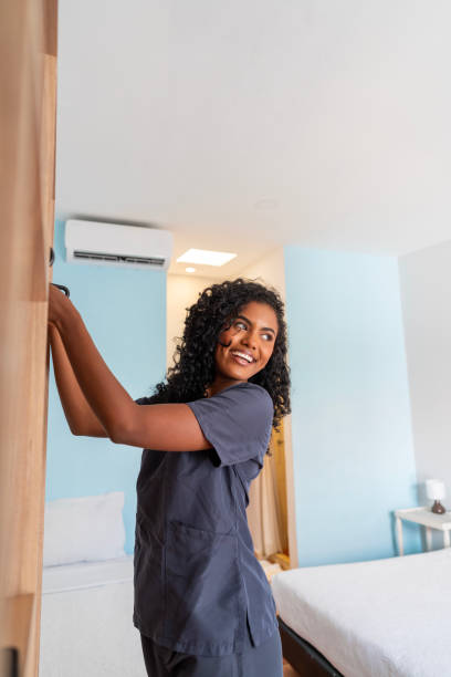 istock Young latin woman from occupation cleaner 2197640495
