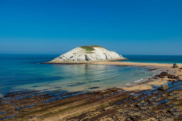istock Covachos beach during the low tide. Cantabria, Spain 2197641000