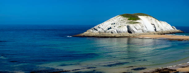 istock Covachos beach during the low tide. Cantabria, Spain 2197641002