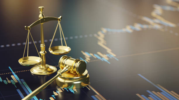 Golden Scales of Justice and Gavel on Financial Chart Background A courtroom gavel and golden scales of justice on a financial analysis chart, representing legal and economic themes. rules quotes stock pictures, royalty-free photos & images