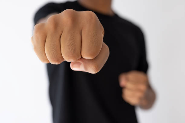 Woman fist in a white isolated background