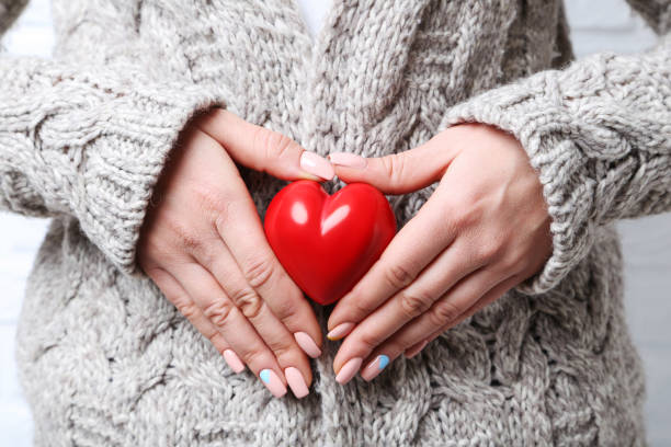 istock Woman holding red heart in hands 2197646807