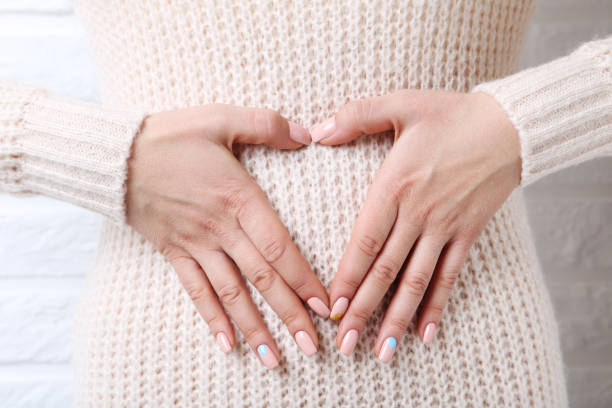 istock Woman showing heart by hands 2197646939