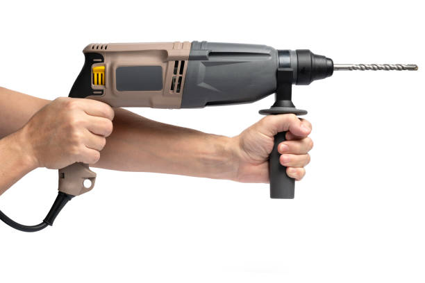 istock Electric punch in hand, highlighted on white background. 2197647148