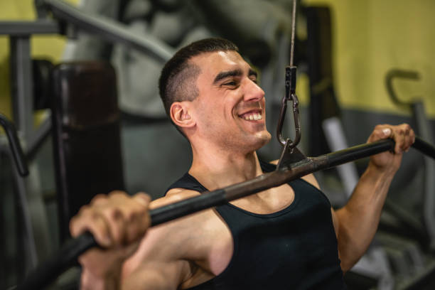istock young muscular man do exercise for chest on the exercise cable machine 2197649188