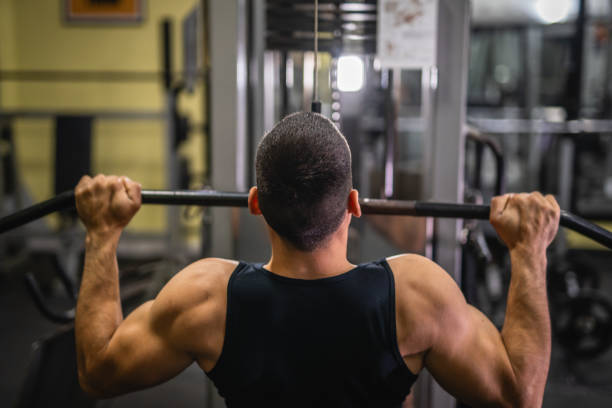 istock young muscular man do exercise for chest on the exercise cable machine 2197650315