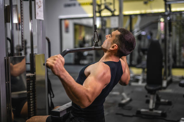 istock young muscular man do exercise for chest on the exercise cable machine 2197650591