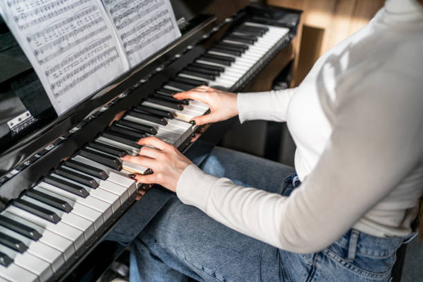 istock Hands of a female piano player 2197650744