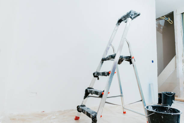 istock Ladder and Paint Buckets in Room Under Renovation 2197656199