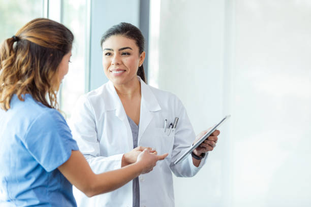 istock Doctor and Patient Discussing Medical Records on Tablet 2197657103
