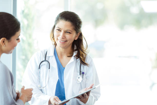 istock Doctor and Patient Discussing Health Concerns Using Tablet 2197657146