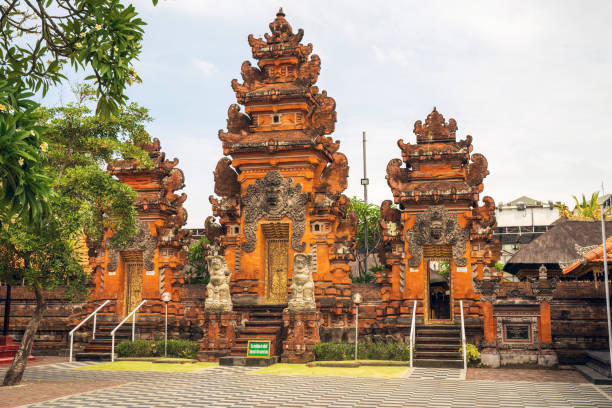 istock Beautiful Balinese temple architecture against overcast clouds 2197657767