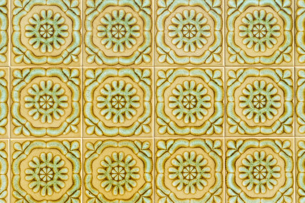 Traditional Portuguese ceramic tiles with an intricate green and gold pattern.