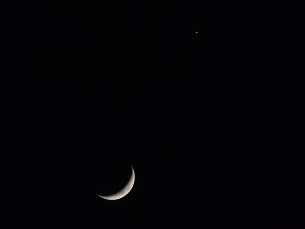 istock Moon and Venus in dark sky 2197668975