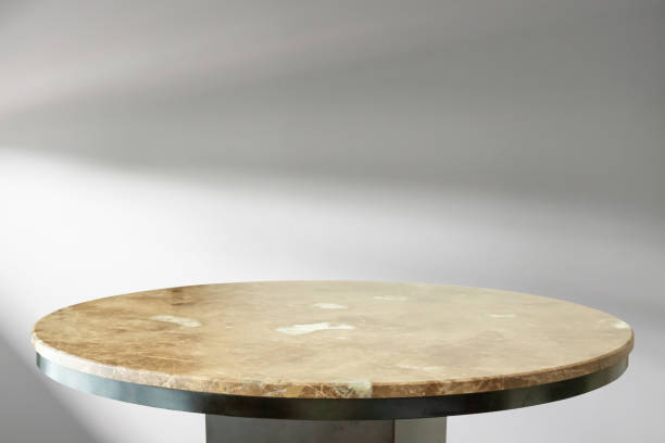 istock Round marble table top with abstract shadow drop on white wall background for mockup product display 2197672982