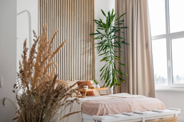 istock Cozy bedroom with natural decor and large window providing ample light 2197674172
