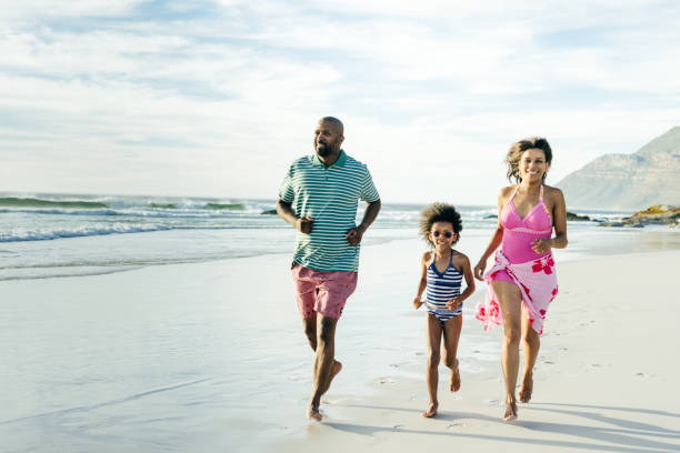istock Coastal Adventures: Families Enjoying Quality Time on the Beach 2197674334