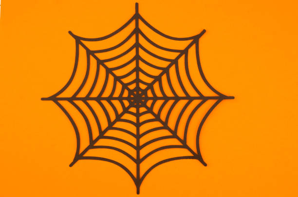istock A detailed black spider web design on a vibrant orange background for seasonal decorations 2197674500