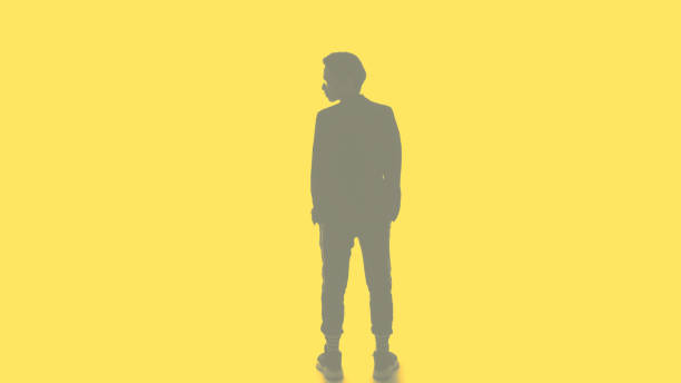 Male silhouette. Leader ambition. Double exposure back view outline of smart business man turning head isolated on yellow.