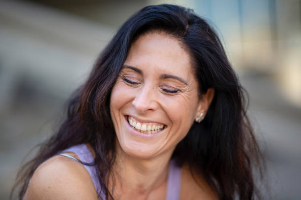 istock Joyful mature woman with her eyes closed 2197674868