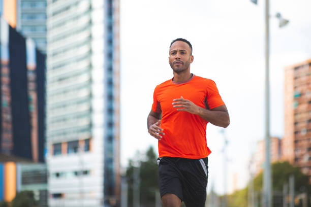 istock Fit man jogging outdoors in city 2197674942