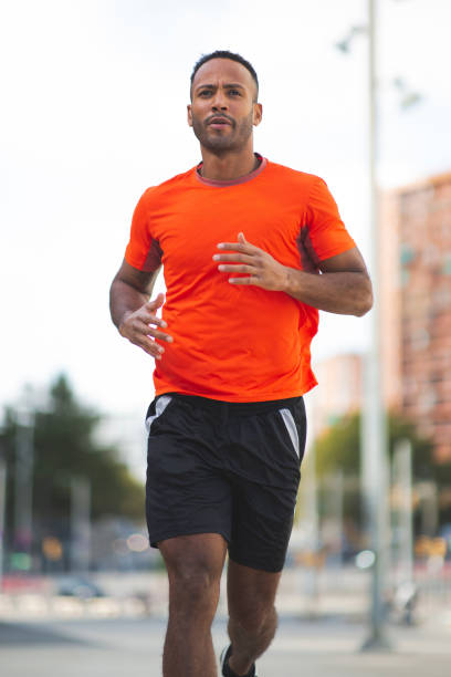 istock Athlete jogging outdoors in city 2197674957