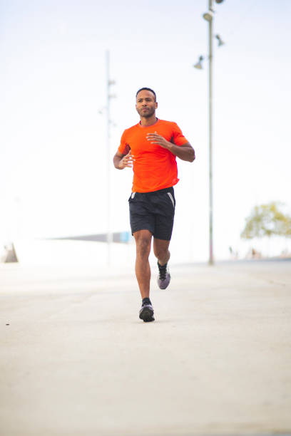 istock Fit man athlete  jogging outdoors in city 2197674964