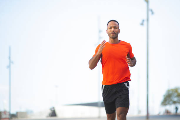 istock Fit man jogging outdoors in city 2197674983