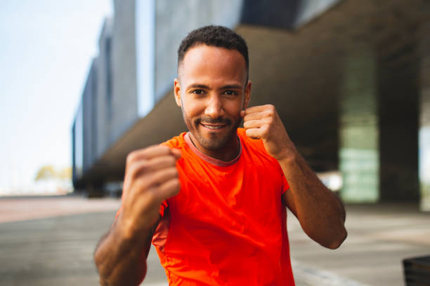 istock Healthy man posing with fighting fists 2197675013