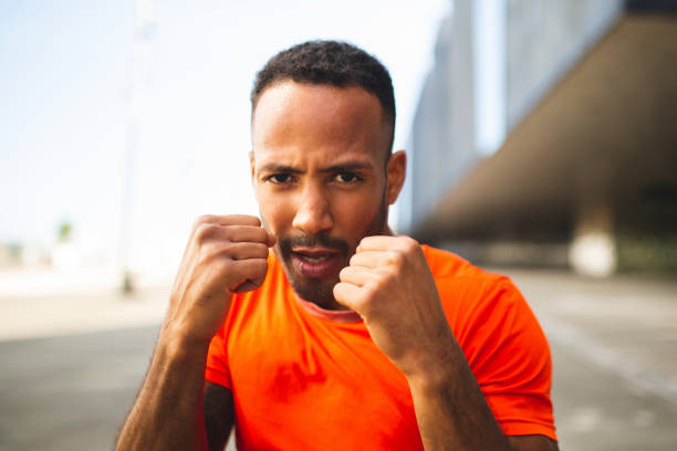 istock Male athlete posing with fighting fists 2197675033