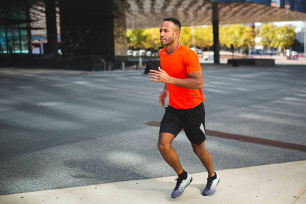istock Fit man athlete  jogging outdoors in city 2197675046