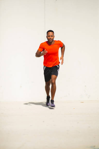 istock Male athlete jogging outdoors in city 2197675049