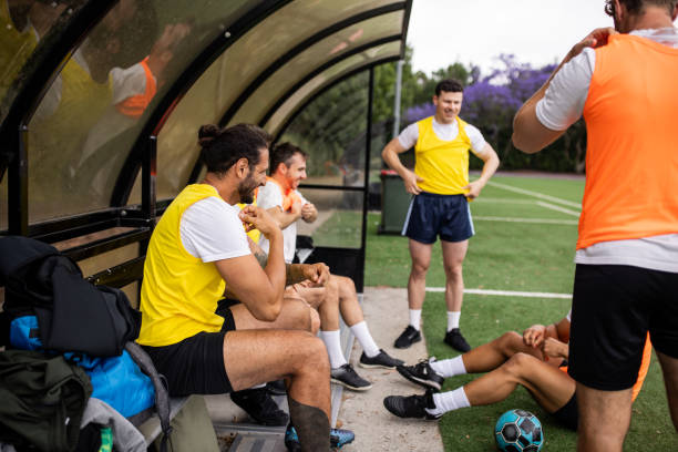 istock Soccer Players Resting After Intense Training 2197675473