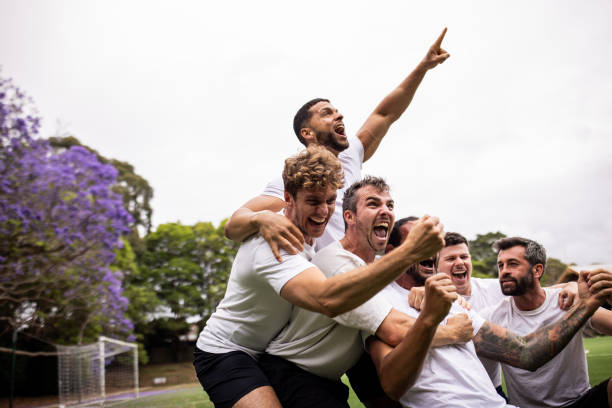 istock Excited Soccer Players Celebrating Post-Match Victory 2197677286