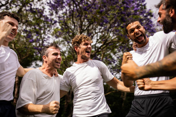 istock Excited Soccer Players Celebrating Post-Match Victory 2197677298