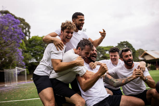 istock Excited Soccer Players Celebrating Post-Match Victory 2197677312