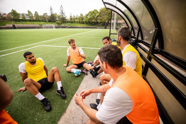 istock Soccer Players Relaxing After Intense Training 2197677937