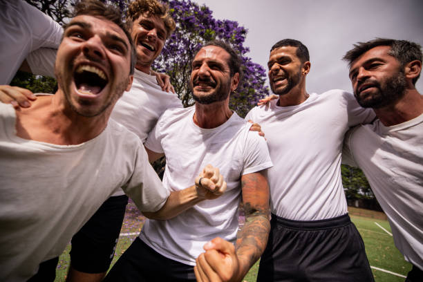 istock Soccer Team Celebrating Victory 2197678353
