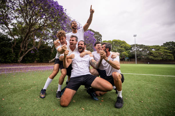 istock Soccer Players Celebrating Win After Match 2197678512