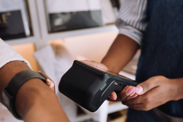 istock Close-up shot of a customer making payment using a smartwatch 2197678668
