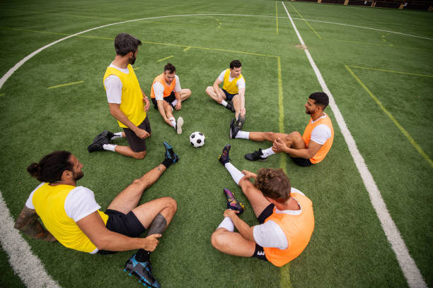 istock Team Warm-Up Session on the Soccer Field 2197678878