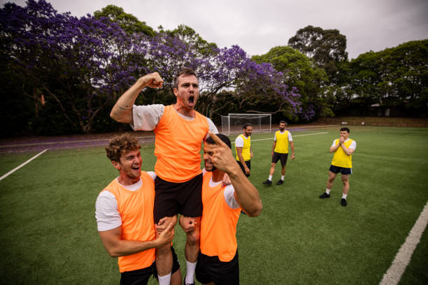 istock Soccer Players Celebrating Goal 2197679660