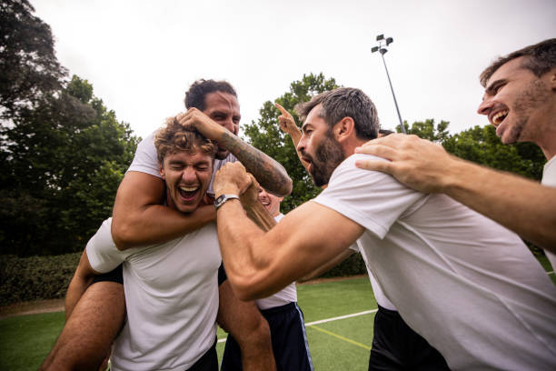 istock Soccer Players Celebrating Scoring a Goal 2197679884