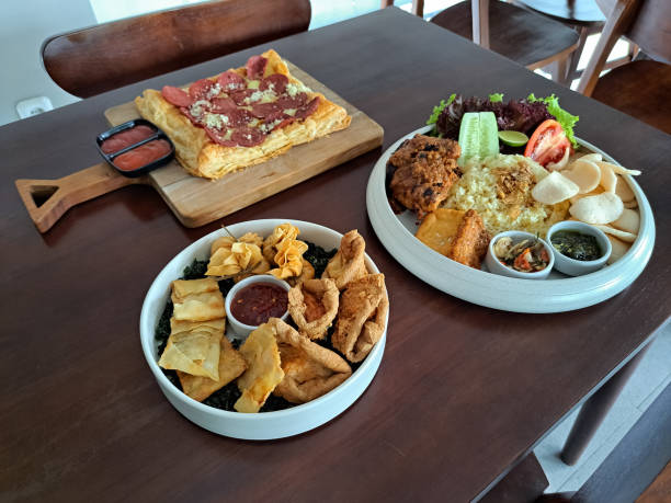 istock Snack Platter With Ekkado, Dumpling Pangsit, Martabak Or Crispy Fried Stuffed Pancake Vegetables Wrap, Tahu Walik Or Fried Tofu, Crispy Vegie And Sambal Bangkok Sauce. Nasi Ayam Bakar Taliwang Or Lombok Grilled Chicken Rice. Pepperoni Pizza. Food Menu. 2197683609